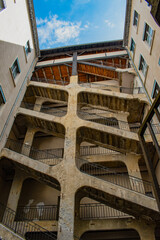 Lyon, France, Europe: view of the Cour des Voraces (Maison de la Republique), a courtyard building in Pentes quarter and famous traboule (covered passage with 3 entrances and a six floor stairway)