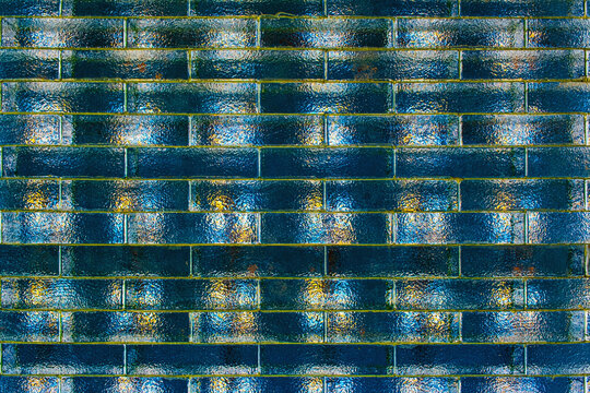 Colorful transparent glass bricks forming a decorative wall