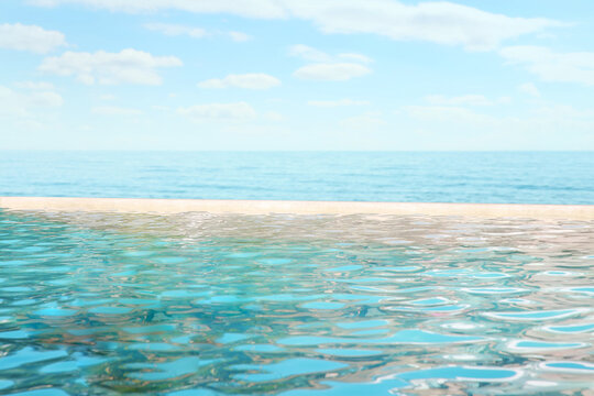 Swimming pool with clear water and view on ocean