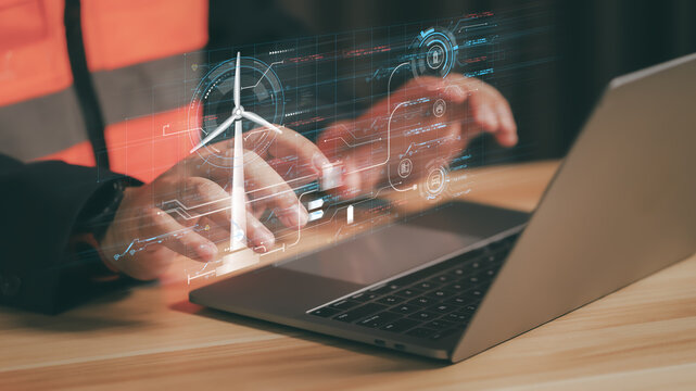 Professional engineer monitoring virtual industrial plant with futuristic holographic interface, representing smart factory technology, digital transformation, and automation in modern manufacturing. - Powered by Adobe