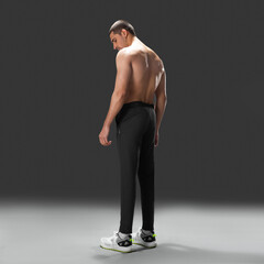 Fit young man wearing sportswear standing in studio