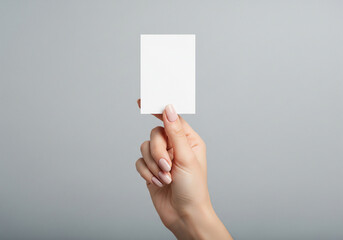 Female Hand Presenting an Empty White Card for Branding Mockup