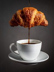 Dynamic zero-gravity coffee-pour with floating croissant and mug.