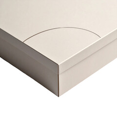 Close-up of a beige, rectangular box corner with a curved indentation on top