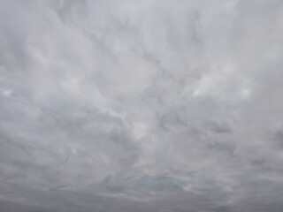 A view of gray, beautiful, thick clouds in the sky on a gloomy, rainy, cold, mystical autumn day