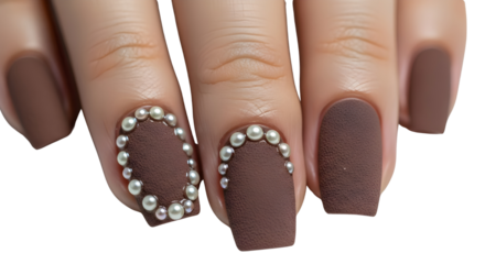 Close-up of luxury matte brown false nails with silver pearl nail art isolated on white background