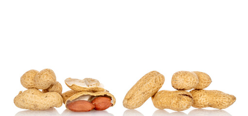 Unshelled peanuts isolated on white background, macro.