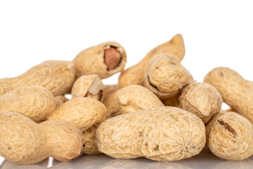 Unshelled peanuts isolated on white background, macro.