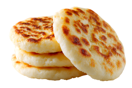 Close up of freshly baked crumpets with distinctive honeycomb texture, stacked and ready to serve