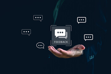 Business feedback concept with digital chat icons floating above businessman’s hand, representing communication, customer review, survey response, user engagement in modern marketing strategy.