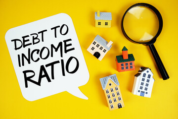 DTI Debt-to-Income Ratio text with house models and magnifying glass on yellow background