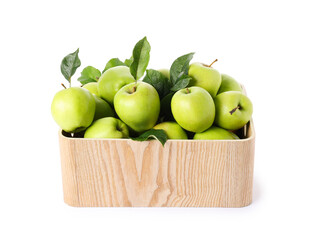 Ripe green apples with fresh leaves in wooden crate isolated on white