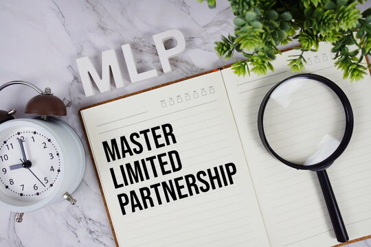 MLP - Master Limited Partnership acronym on notepad, Business concept background