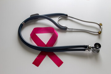 World AIDS Day emblem and a stethoscope. On a white background.