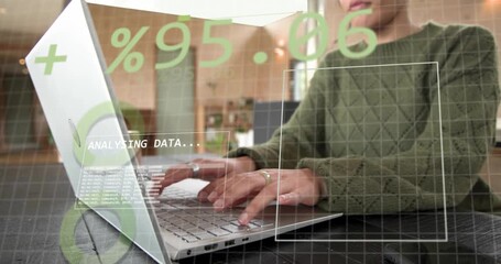 Data analyst typing on laptop analysing charts grabbing phone showing binary code sipping coffee - Powered by Adobe
