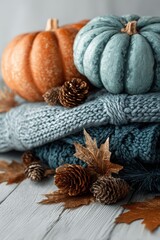 Rustic Fall banner, pastel blue, orange pumpkins, warm wool blanket, leaves on distressed wood. Autumn Mocap social media, invitations, seasonal ads, product mockups. Copy space. Thanksgiving banner