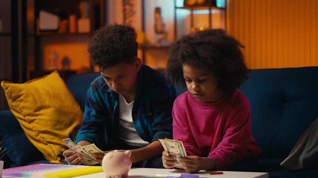 Two African American kids counting money, having not enough for their dream