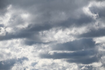 Black and white clouds on a blue sky background, cloud background