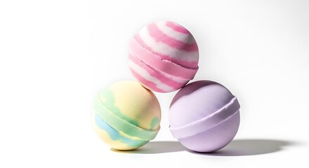 Three colorful makeup sponges stacked in a pyramid formation isolated on white background