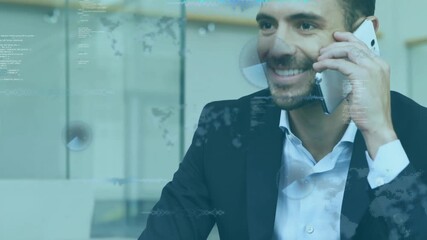 male professional lifting smartphone to ear then showing animated charts celebrating business deal - Powered by Adobe