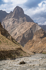 Scenic vertical mountain landscape view of Panj river valley in summer, Rushan, Gorno-Badakhshan, Tajikistan Pamir