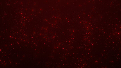 Bright red luminous particles in motion on black backdrop.