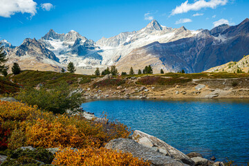 A turquoise mountain lake in an alpine valley