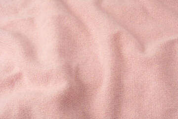 Fototapeta premium Soft pink cashmere sweater texture background.