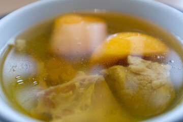 Close-up of Chinese Chicken soup. Healthy soup in Chinese cuisine. Food and beverage concept.