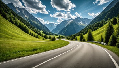 Naklejka premium Winding road through a verdant valley with majestic mountains and blue sky