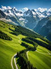 Breathtaking alpine scenery lush green slopes, winding road, and snow-capped peaks
