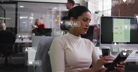 Office woman tapping tablet, monitoring social media engagement via animated icons clustering - Powered by Adobe