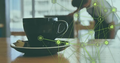 At start, camera showing close-up on coffee cup on table, green network animating data growth - Powered by Adobe