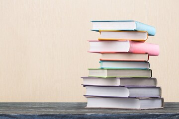 Vintage old stack books on a wooden deck
