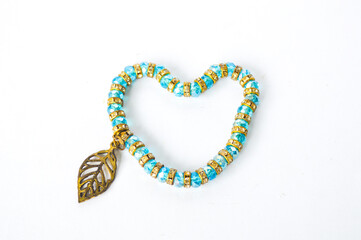 Beautiful bracelet combination of blue stones and metal on a white background. art high quality bracelet