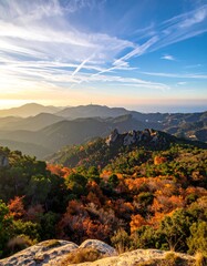 Scenic view of layered mountain ranges with vibrant foliage