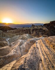 Sunset casts a golden glow on a desert landscape