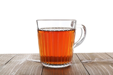 Cup of aromatic black tea on wooden table against white background