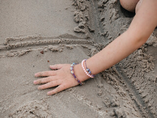 Child Playing with Sand on Beach – Summer Vacation Fun