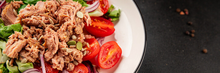 Tuna salad canned fish, tomato, green leaf salad vegetable dish natural tasty snack fresh gourmet food background on the table rustic top view copy space keto paleo diet vegetarian food pescetarian