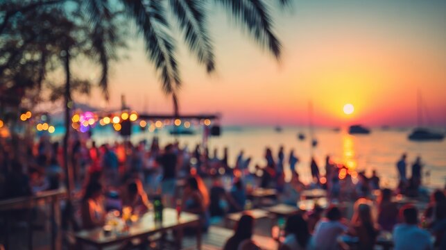 blurred people having sunset beach party in summer vacation  defocused image  concept of nightlife with cocktails and music entertainment no logos no brands ar 169