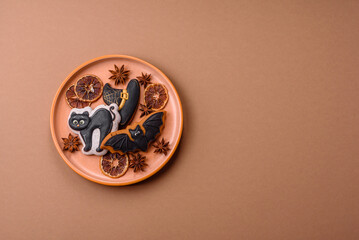Halloween cookies, sweets, or gingerbread, a cat, a bat, and a hat. Halloween gingerbread