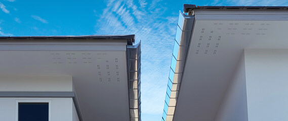 Guttering system with roof, Residential architecture detail, House roof with rain gutter of roof top house, Rainwater drainage system, Building construction. © rawintanpin