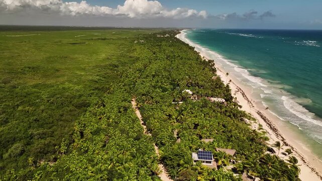 Aerial 4K drone view of Tulum coastline and Caribbean beach Mexico - tropical sea waves and Sian Kaan biosphere reserve