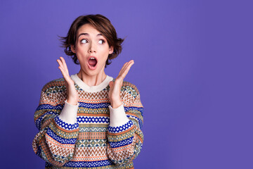 Photo of impressed pretty nice woman wear stylish clothes look empty space isolated on purple color...