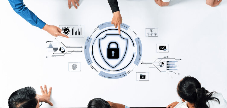 Diverse team collaborates on cybersecurity strategies while analyzing data and discussing protection icons on a modern digital workspace table. Trope