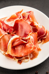 jamon serrano meat appetizer jamon iberico natural product tasty snack fresh delicious gourmet food background on the table rustic top view copy space