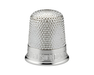 Close-up view of a lustrous silver thimble, adorned with intricate textures and precise detailing