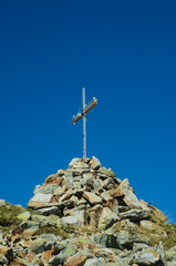 Cross on the top of mount Cima Venina, Lombardy, Italy 