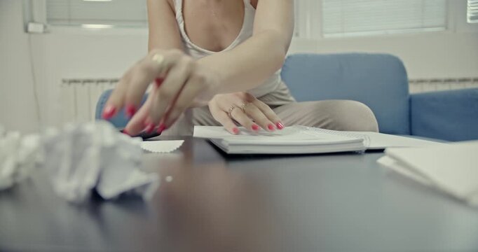Experience the calming and satisfying sounds of a woman interacting with paper and a notebook. This ASMR video captures every rustle and crumple, perfect for relaxation and focus.